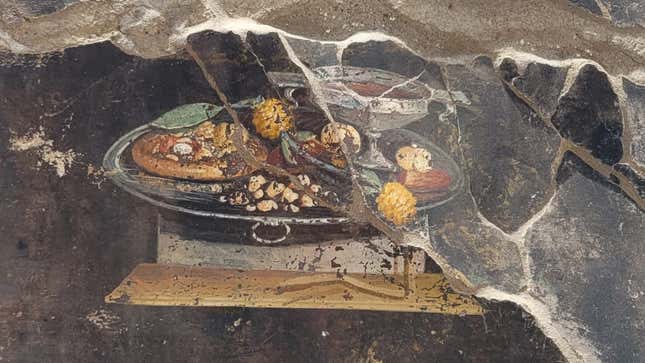 Posible antepasado de la pizza en un fresco hallado en Pompeya