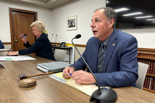 North Dakota Public Service Commission Chairman Randy Christmann, right, begins a meeting of the commission at the state Capitol in Bismarck, N.D., Friday, Sept. 15, 2023. At left is Commissioner Sheri Haugen-Hoffart. The panel, in a 2-1 vote, approved a request by Summit Carbon Solutions to reconsider the commission's Aug. 4 decision to deny a siting permit for the company's proposed 320-mile route in North Dakota. The leg is part of Summit's proposed $5.5 billion, 2,000-mile, five-state pipeline network to carry planet-warming carbon dioxide emissions from 30-some Midwestern ethanol plants to central North Dakota for permanent storage deep underground. (AP Photo/Jack Dura)