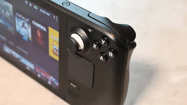 A Steam Deck with the photo focused on the face buttons and control stick.