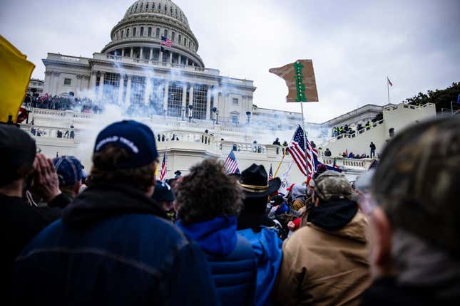 WASHINGTON, DC - JANUARY 06: Pro-Trump supporters storm the U.S. Capitol following a rally with President Donald Trump on January 6, 2021, in Washington, DC. Trump supporters gathered in the nation’s capital today to protest the ratification of President-elect Joe Biden’s Electoral College victory over President Trump in the 2020 election.