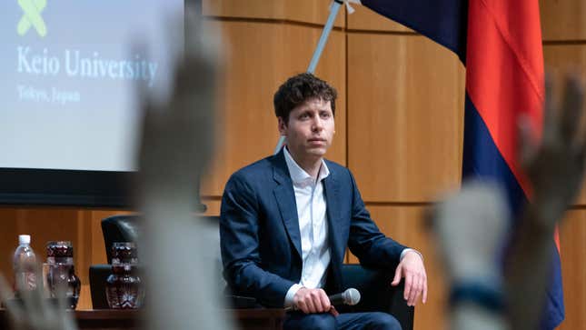 Students raise their hands for a question as OpenAI Chief Executive Officer Sam Altman looks on during an event at Keio University on June 12, 2023 in Tokyo, Japan.