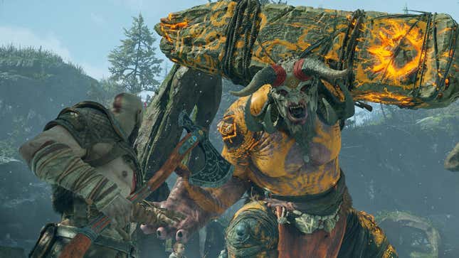 The God of War fights a horned monster carrying a giant slab of rock with yellow runes etched into it. 