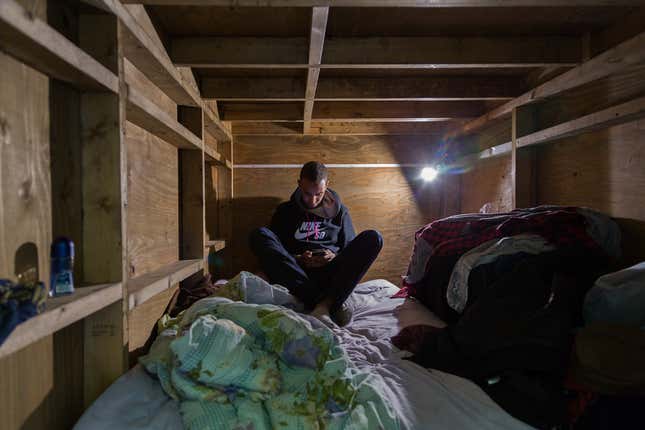 Image for article titled Photos: Tokyo travelers get comfortable in the tiniest of spaces