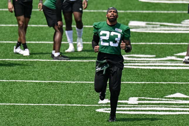 May 23, 2023; Florham Park, NJ, USA; New York Jets safety Chuck Clark (23) warms up during OTA s at Atlantic Health Jets Training Center.