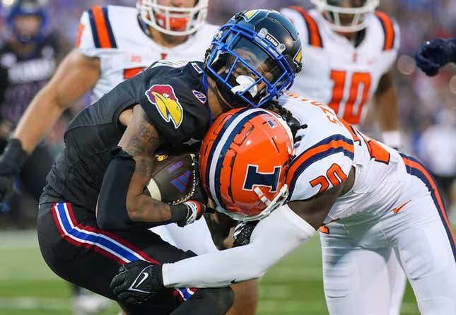Sep 8, 2023; Lawrence, Kansas, USA; Kansas Jayhawks wide receiver Quentin Skinner (0) is tackled by Illinois Fighting Illini defensive back Tyler Strain (20) during the first half at David Booth Kansas Memorial Stadium.