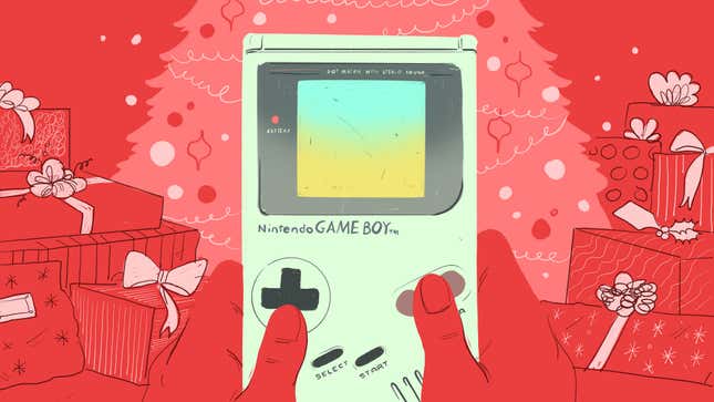 A Game Boy is held up against a holiday backdrop of presents and a Christmas tree.
