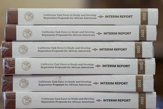 Copies of the interim report issued by California’s first-in-the-nation task force on reparations for African Americans are displayed at the Capitol in Sacramento, Calif., on June 16, 2022. The Coalition for a Just and Equitable California, that pushed to create the reparations task force, is urging Democratic Gov. Gavin Newsom to veto legislation extending the deadline for the committee to complete its work. The Coalition and other organizations sent a letter to Newsom last week saying that the legislation to extend the deadline a year by task force member, Democratic Assemblyman Reginald Jones-Sawyer, will demoralize descendants of enslaved people who fear they’ll never be compensated