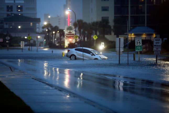 A car plunged into flood waters on Ocean Boulevard in North Myrtle Beach on August. 30, 2023 after the passage of Hurricane Idalia.