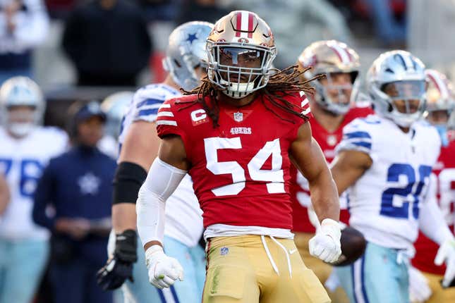 San Francisco 49ers' Fred Warner (54) and teammates celebrate his  interception against the Kans …