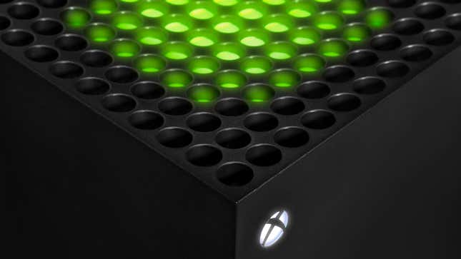 An Xbox Series X glows green.