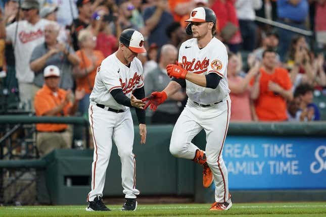Jun 13, 2023; Baltimore, Maryland, USA; Baltimore Orioles designated hitter Gunnar Henderson (2) is greeted by coach Tony Mansolino (36) following his third inning grand slam against the Toronto Blue Jays at Oriole Park at Camden Yards.