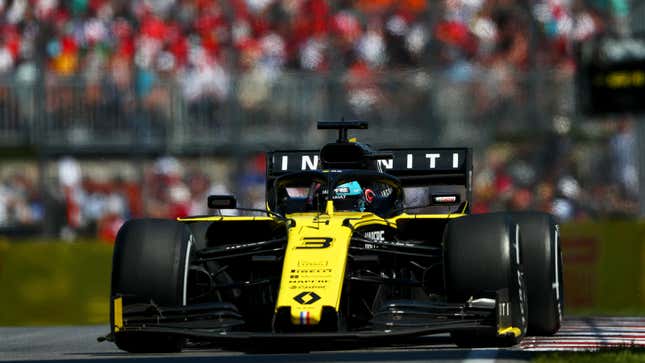 A photo of Daniel Ricciardo driving his yellow and black 2019 Renault F1 car in Canada. 
