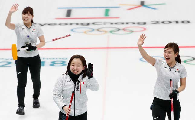 Curling - Pyeongchang 2018 Winter Olympics - Women Round Robin - Olympic Athletes from Russia v Japan - Gangneung Curling Center - Gangneung, South Korea - February 17, 2018 - Lead Yurika Yoshida, skip Satsuki Fujisawa and vice-skip Chinami Yoshida of Japan react after winning the game. REUTERS/Cathal McNaughton - DEVEE2H13H0BA