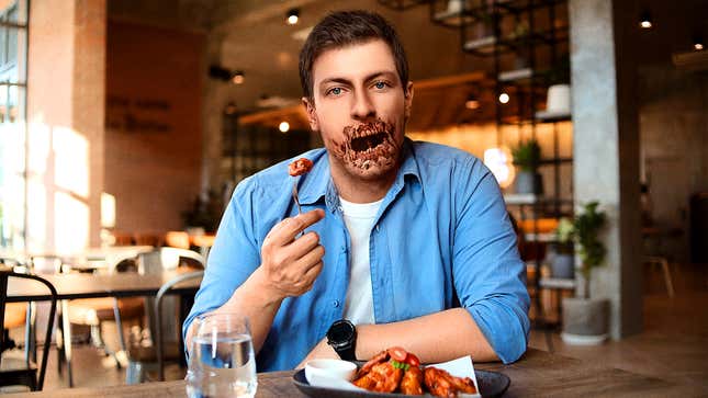 Image for article titled ‘It’s Not Too Bad,’ Says Man As Hot Sauce Begins Disintegrating Jaw