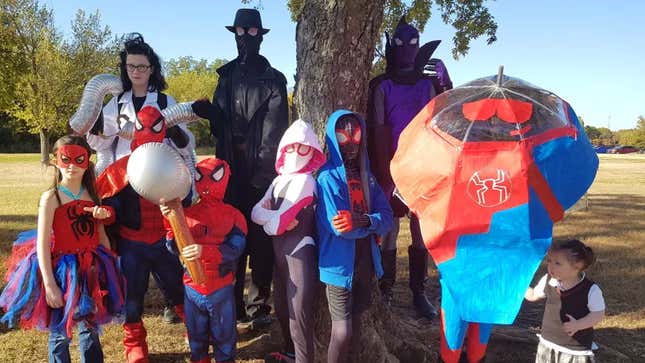 A family dressed up as various characters from Spider-Man: Into the Spider-Verse, including Doc Ock, Spider-Man Noir, Spider-Gwen, Spider-Ham, Prowler, and Miles Morales.