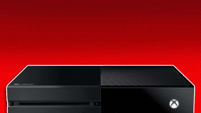 A black Xbox One console lays flat against a red background. 