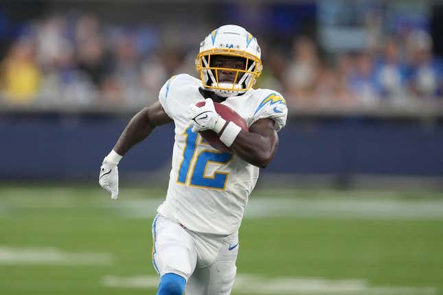 Aug 12, 2023; Inglewood, California, USA; Los Angeles Chargers wide receiver Derius Davis (12) scores on an 81-yard punt return in the first half against the Los Angeles Rams at SoFi Stadium.