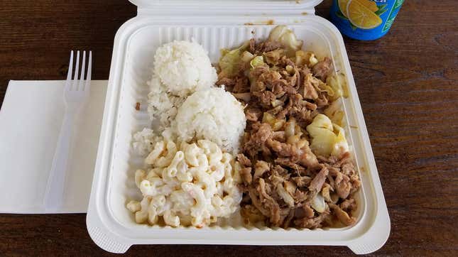 Hawaiian plate lunch featuring kalua pig, cabbage, white rice, and macaroni salad