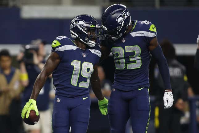 Aug 26, 2022; Arlington, Texas, USA; Seattle Seahawks wide receiver Penny Hart (19) and wide receiver Dareke Young (83) celebrate a touchdown in first quarter against the Dallas Cowboys at AT&amp;amp;T Stadium.