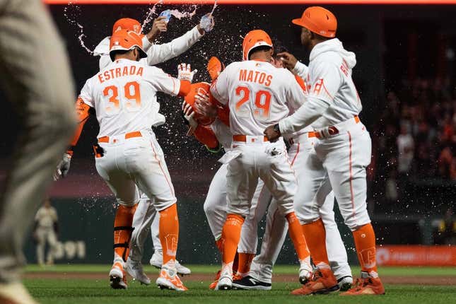 Jun 20, 2023; San Francisco, California, USA;  San Francisco Giants celebrate with designated hitter Joc Pederson (23) after winning the game against the San Diego Padres on a walk off walk at Oracle Park.