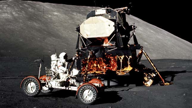 Apollo 17 mission commander Eugene Cernan drives the lunar roving vehicle with the Lunar Module in the background.