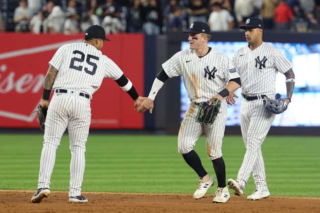 Aug 23, 2023; Bronx, New York, USA; New York Yankees center fielder Harrison Bader (22) celebrates with second baseman Gleyber Torres (25) and center fielder Everson Pereira (80) after defeating the Washington Nationals at Yankee Stadium.