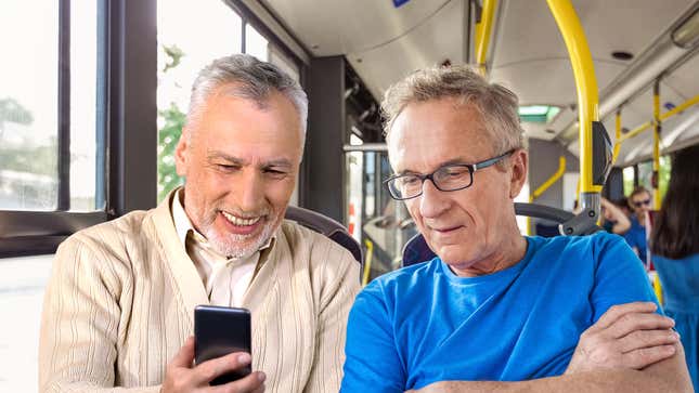 Image for article titled Nation’s Male Bus Strangers Announce Plans To Show Each Other Pictures Of Swimsuit Models On Their Phones
