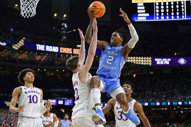 Apr 4, 2022; New Orleans, LA, USA; North Carolina Tar Heels guard Caleb Love (2) loses control of the ball while defended by Kansas Jayhawks guard Christian Braun (2) during the second half during the 2022 NCAA men&#39;s basketball tournament Final Four championship game at Caesars Superdome.