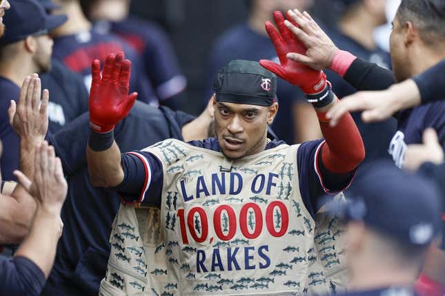 Sep 17, 2023; Chicago, Illinois, USA; Minnesota Twins second baseman Jorge Polanco (11) celebrates with teammates in the dugout after hitting a solo home run against the Chicago White Sox during the eight inning at Guaranteed Rate Field.