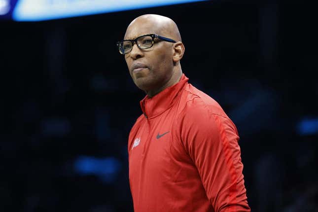 Mar 17, 2023; Charlotte, North Carolina, USA; Philadelphia 76ers assistant coach Sam Cassell looks on from the sideline during the first half against the Charlotte Hornets at Spectrum Center.