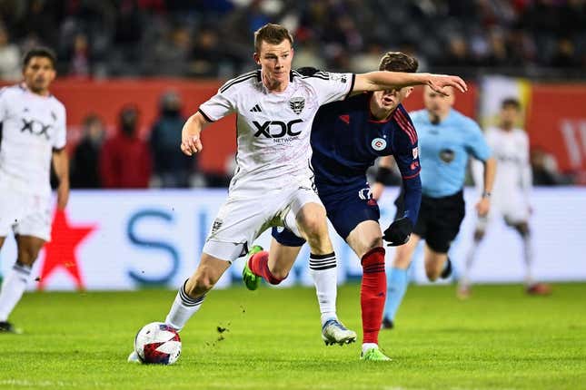 Apr 1, 2023; Chicago, Illinois, USA;  DC United midfielder Chris Durkin (8) controls the ball against the Chicago Fire FC at Soldier Field.