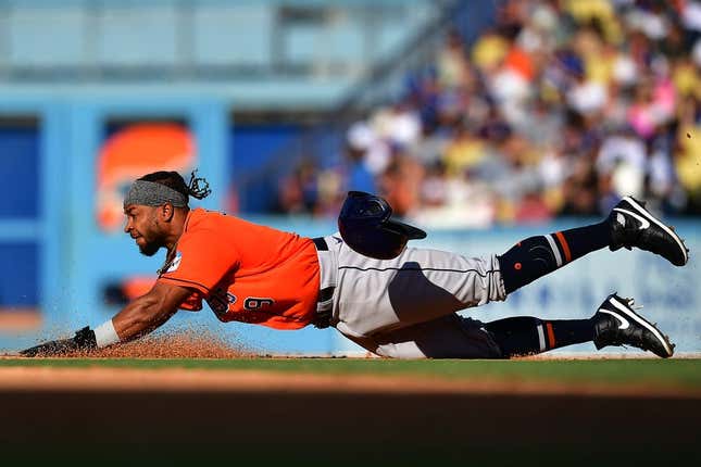 Jun 25, 2023; Los Angeles, California, USA; Houston Astros designated hitter Corey Julks (9) steals second against the Los Angeles Dodgers during the seventh inning at Dodger Stadium.