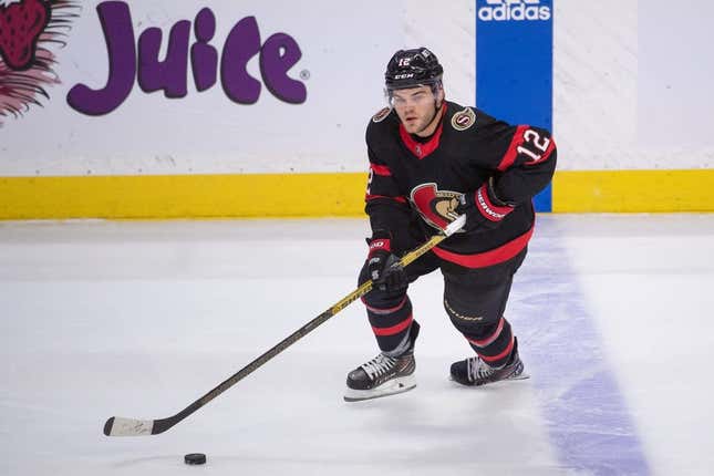 Apr 10, 2023; Ottawa, Ontario, CAN; Ottawa Senators right wing Alex DeBrincat (12) skates with the puck in the third period against the Carolina Hurricanes at the Canadian Tire Centre.