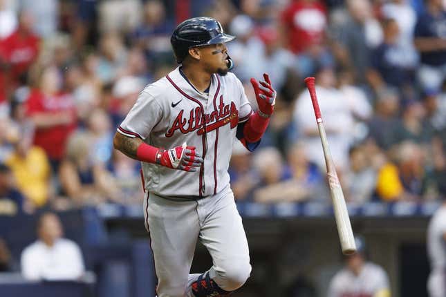 Jul 21, 2023; Milwaukee, Wisconsin, USA;  Atlanta Braves shortstop Orlando Arcia (11) flips his bat after hitting a home run during the second inning against the Milwaukee Brewers at American Family Field.