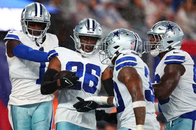 Sep 10, 2023; East Rutherford, New Jersey, USA; Dallas Cowboys cornerback DaRon Bland (26) celebrates his touchdown against the New York Giants during the first half at MetLife Stadium.