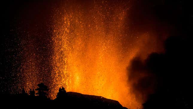 Lava shoots into the sky from an eruption of a volcano at the island of La Palma.