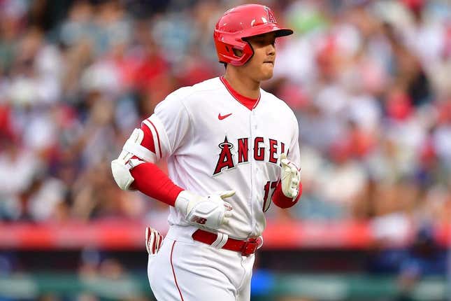 Aug 19, 2023; Anaheim, California, USA; Los Angeles Angels designated hitter Shohei Ohtani (17) returns to the dugout after hitting a pop fly ball during the first inning at Angel Stadium.