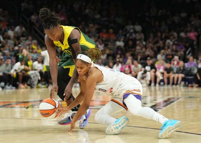 Aug 5, 2023; Phoenix, Arizona, USA; Seattle Storm guard Jewell Loyd (24) and Phoenix Mercury guard Moriah Jefferson (8) go after a loose ball during the second half at Footprint Center.