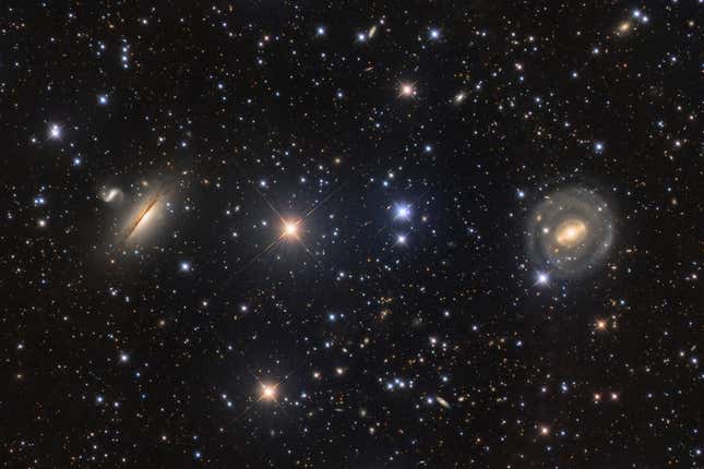 Several galaxies, against a background of countless stars and other galaxies.