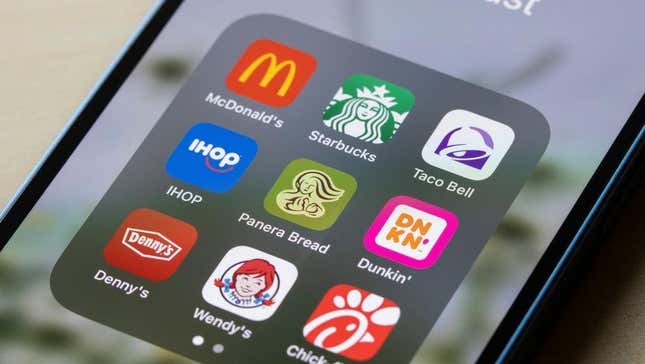 Phone showing mobile apps for fast food loyalty programs