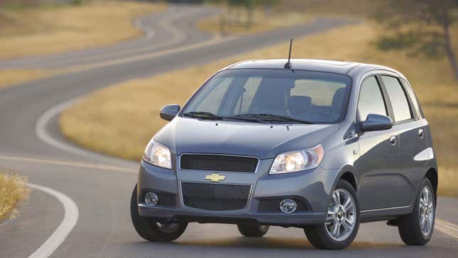 A photo of a silver Chevrolet Aveo hatchback. 