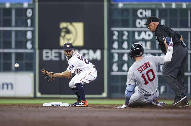 Aug 23, 2023; Houston, Texas, USA; Boston Red Sox shortstop Trevor Story (10) is safe at second base with a double as Houston Astros second baseman Jose Altuve (27) attempts to field a throw during the second inning at Minute Maid Park.