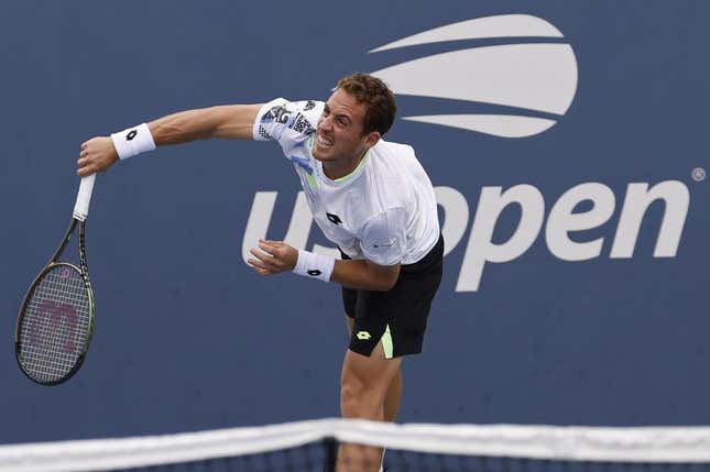 Aug 28, 2023; Flushing, NY, USA; Roberto Carballes Baena of Spain serves against Hulger Rune of Denmark (not pictured) on day one of the 2023 US Open at the Billie Jean King National Tennis Center.