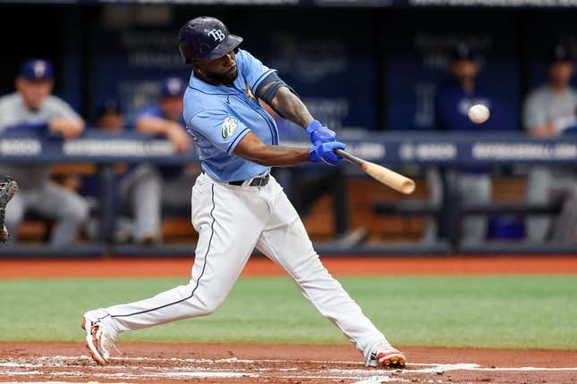 Jun 11, 2023; St. Petersburg, Florida, USA;  Tampa Bay Rays left fielder Randy Arozarena (56) hits an rbi single against the Texas Rangers in the first inning at Tropicana Field.