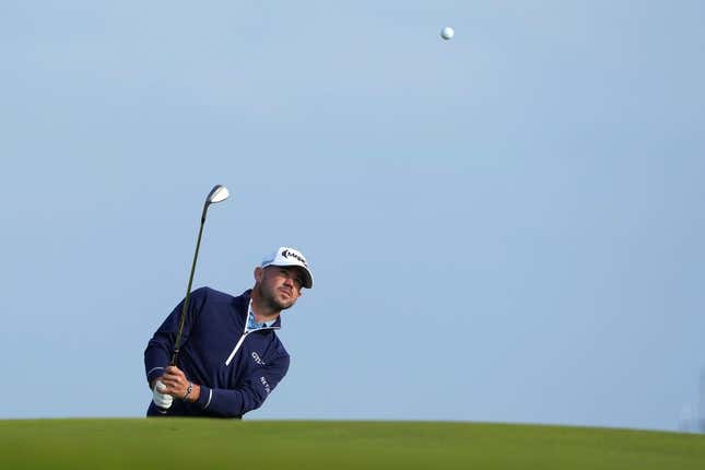 July 20, 2023; Hoylake, England, GBR; Brian Harman plays a shot onto the 17th green during the first round of The Open Championship golf tournament at Royal Liverpool.