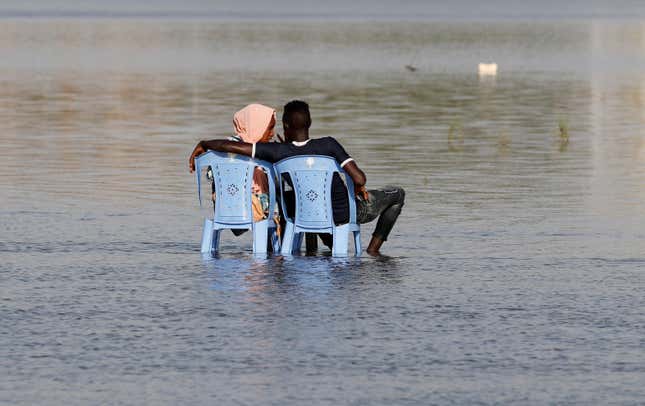 A Sudanese couple enjoy the shallow waters of the Nile River in Khartoum, Sudan, April 24, 2019.