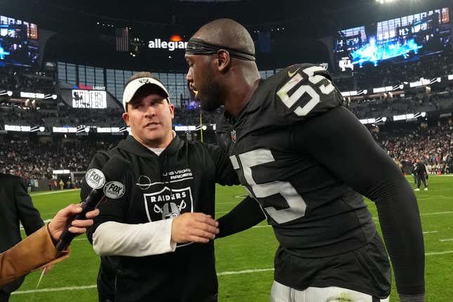 Dec 18, 2022; Paradise, Nevada, USA; Las Vegas Raiders coach Josh McDaniels (left) and defensive end Chandler Jones (55) embrace at the end of the game against the New England Patriots at Allegiant Stadium. The Raiders defeated the Patriots 30-24.