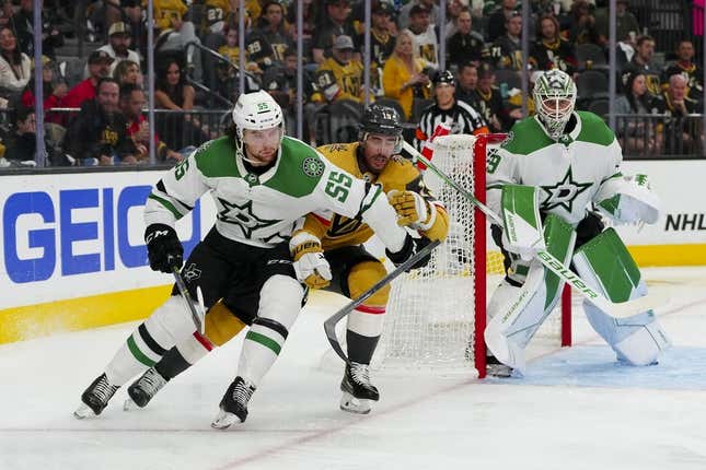 May 27, 2023; Las Vegas, Nevada, USA; Dallas Stars defenseman Thomas Harley (55) keeps the puck away from Vegas Golden Knights right wing Reilly Smith (19) during the second period in game five of the Western Conference Finals of the 2023 Stanley Cup Playoffs at T-Mobile Arena.
