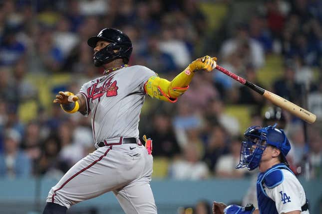 Aug 31, 2023; Los Angeles, California, USA; Atlanta Braves right fielder Ronald Acuna Jr. (13) hits a grand slam home run in the second inning against the Los Angeles Dodger at Dodger Stadium.