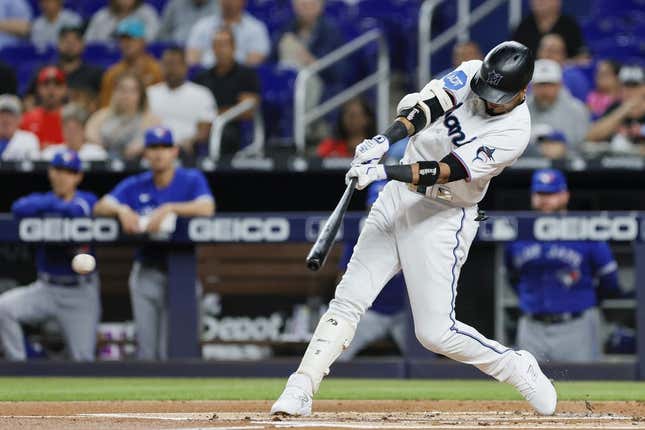 Jun 19, 2023; Miami, Florida, USA; Miami Marlins second baseman Luis Arraez (3) hits a single against the Toronto Blue Jays during the first inning at loanDepot Park.